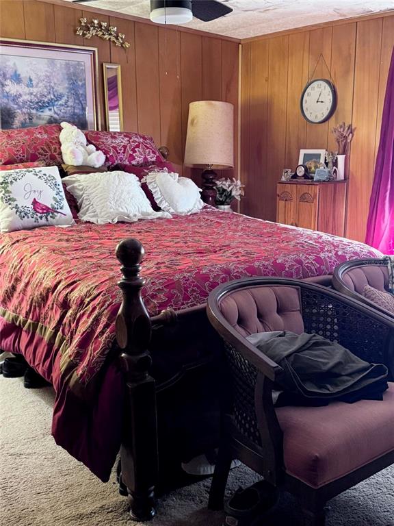 17134 Lake Ingram Road Winter Garden, FL 34787 - Photo 11 of 19 a bedroom with a bed and a lamp