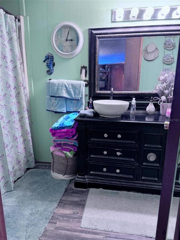 17134 Lake Ingram Road Winter Garden, FL 34787 - Photo 13 of 19 a room with furniture and a dresser