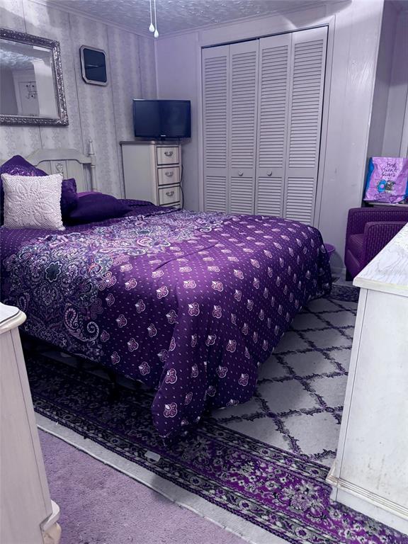 17134 Lake Ingram Road Winter Garden, FL 34787 - Photo 15 of 19 a bedroom with a bed dresser and a flat screen tv