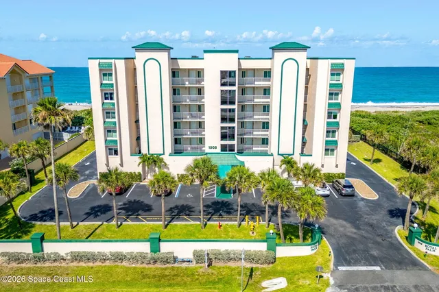 a front view of building with yard