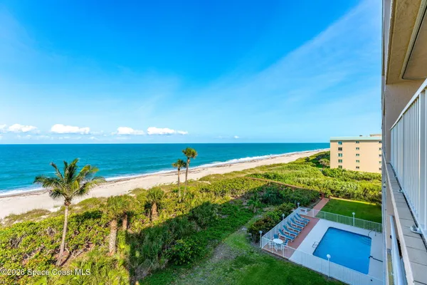 a view of a yard with an ocean