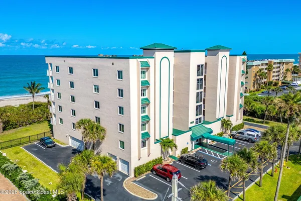 a view of a chairs and table in a backyard