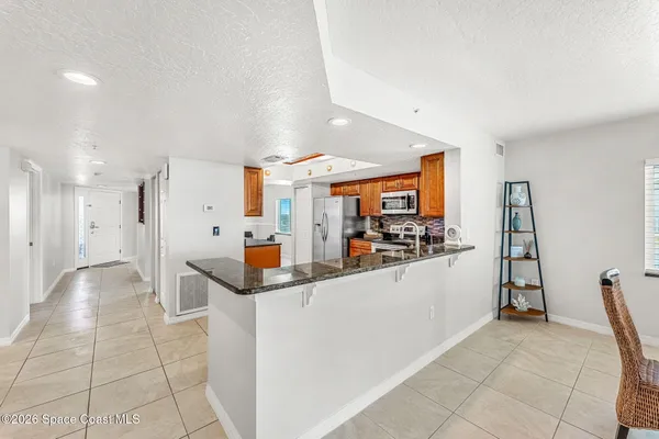 a kitchen with stainless steel appliances a refrigerator and a sink