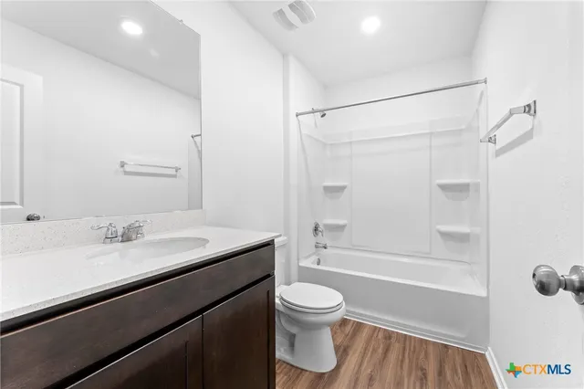 a bathroom with a sink a toilet and a bathtub