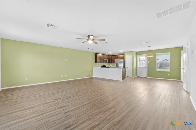 a view of a room with a wooden floor