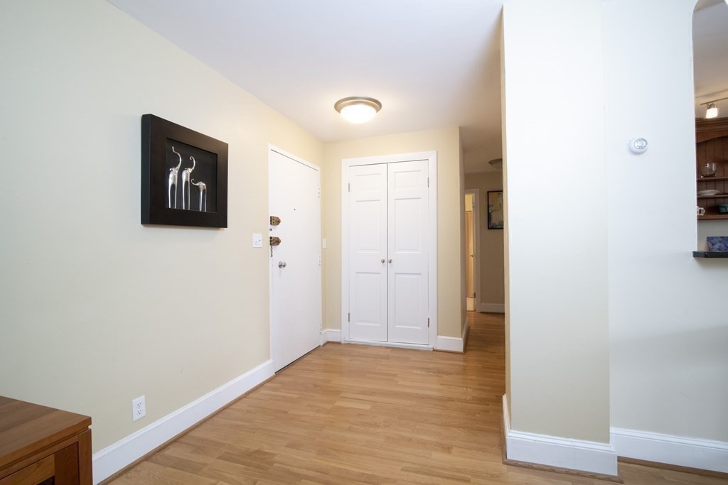 131 Sewall Avenue, Unit 37 Brookline, MA 02446 - Photo 17 of 27 a view of a hallway with wooden floor
