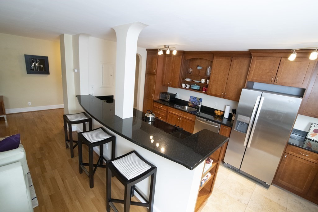 131 Sewall Avenue, Unit 37 Brookline, MA 02446 - Photo 7 of 27 a living room with chairs and furniture