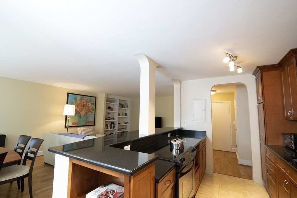 131 Sewall Avenue, Unit 37 Brookline, MA 02446 - Photo 9 of 27 a workspace with furniture and lamp