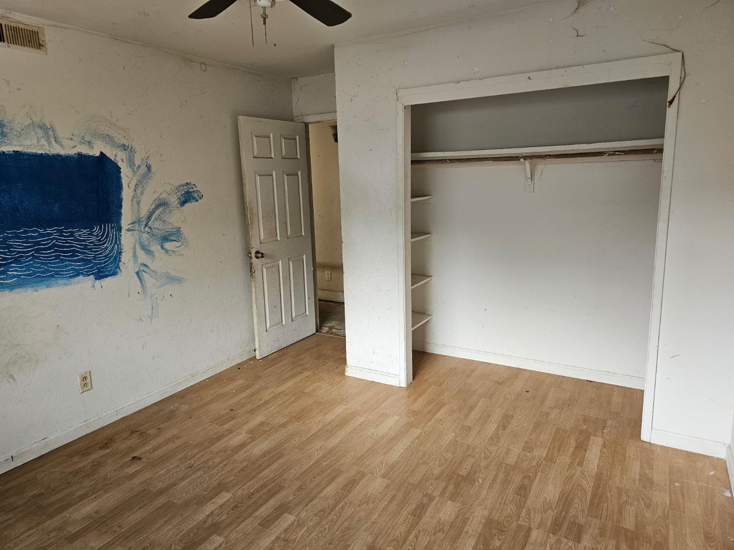 537 North Granada Drive Madera, CA 93637 - Photo 12 of 27 a view of an empty room with wooden floor and a window