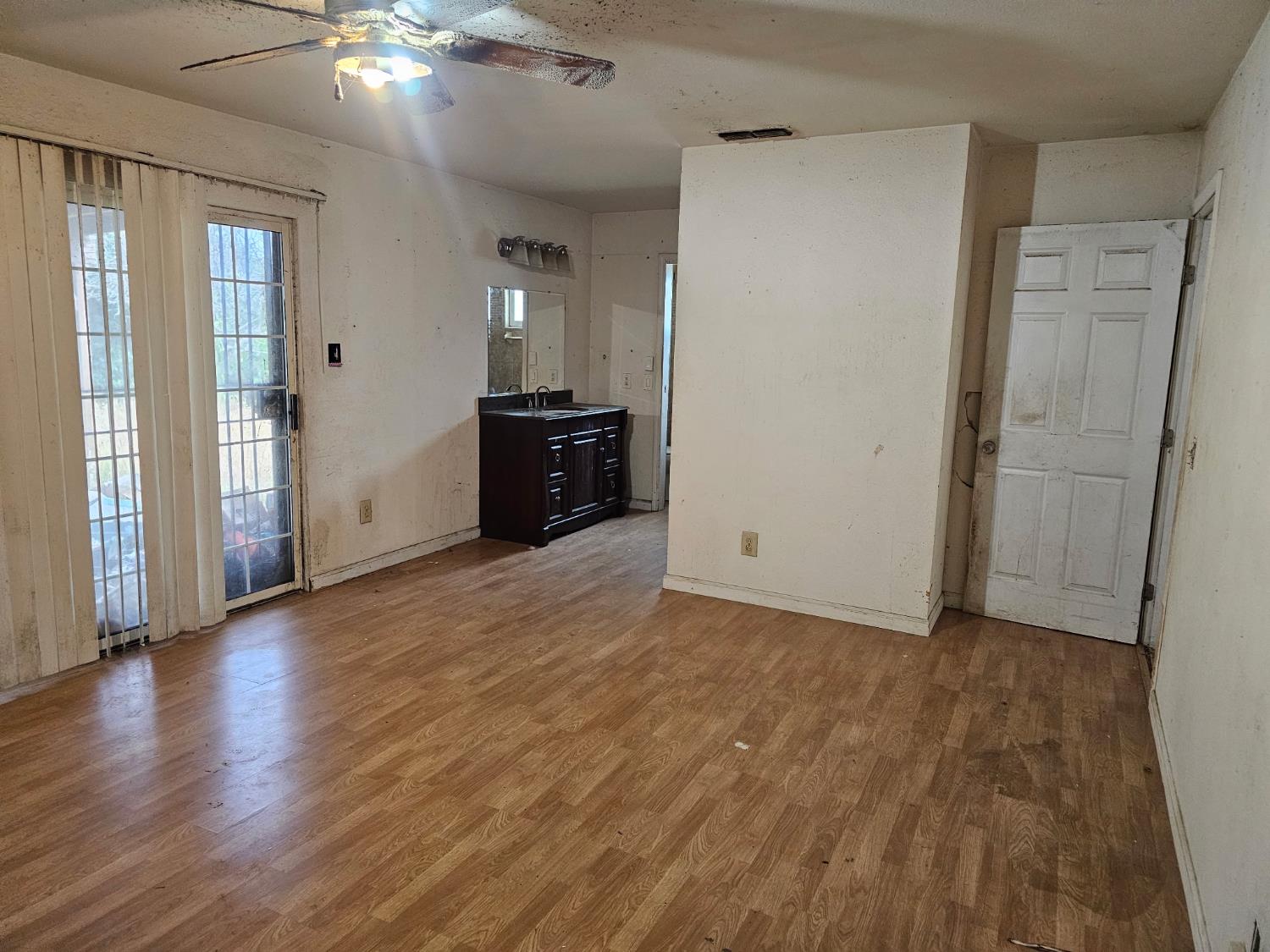 537 North Granada Drive Madera, CA 93637 - Photo 6 of 27 wooden floor in an empty room with a window