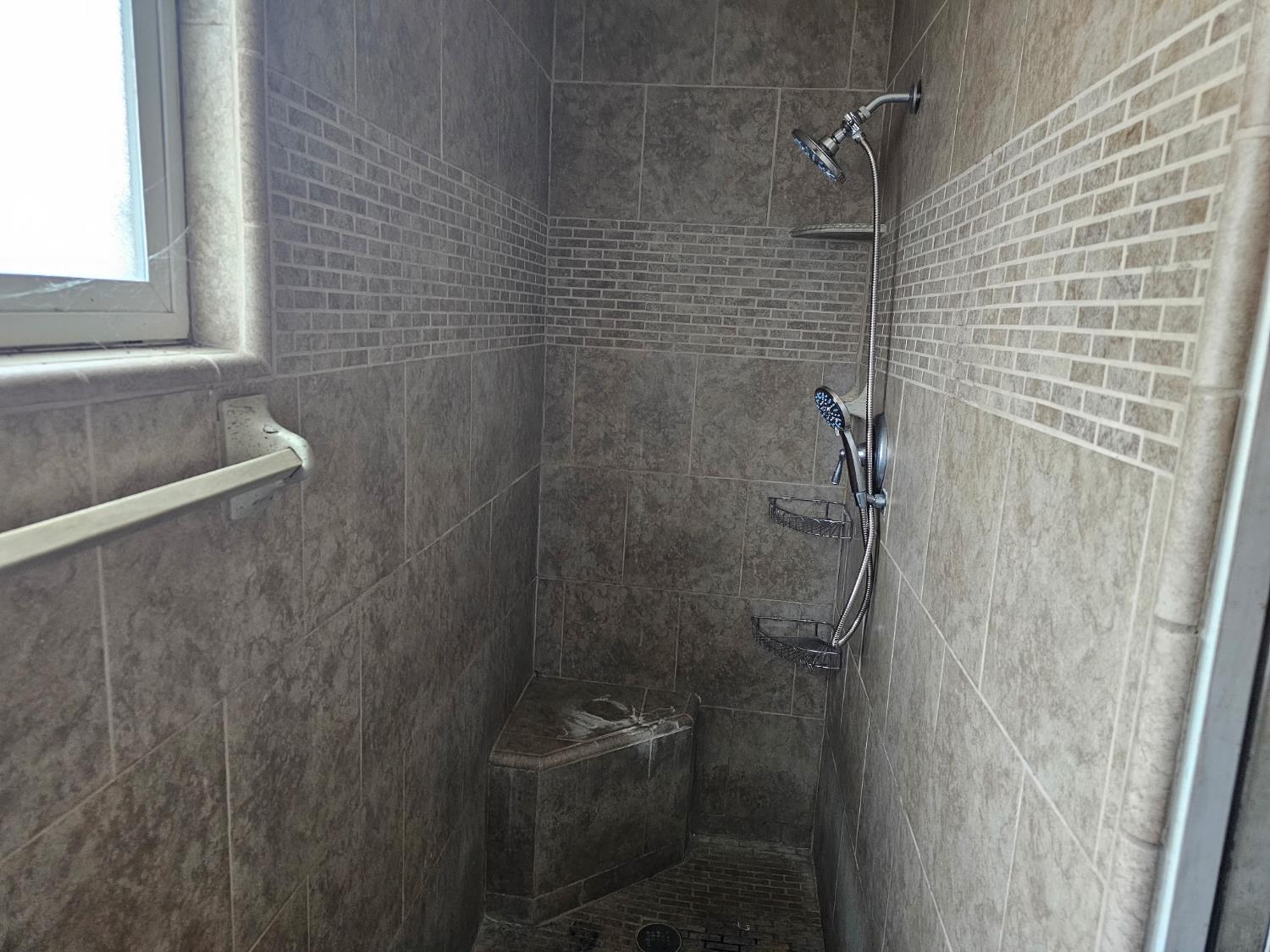 537 North Granada Drive Madera, CA 93637 - Photo 10 of 27 a bathroom with a shower