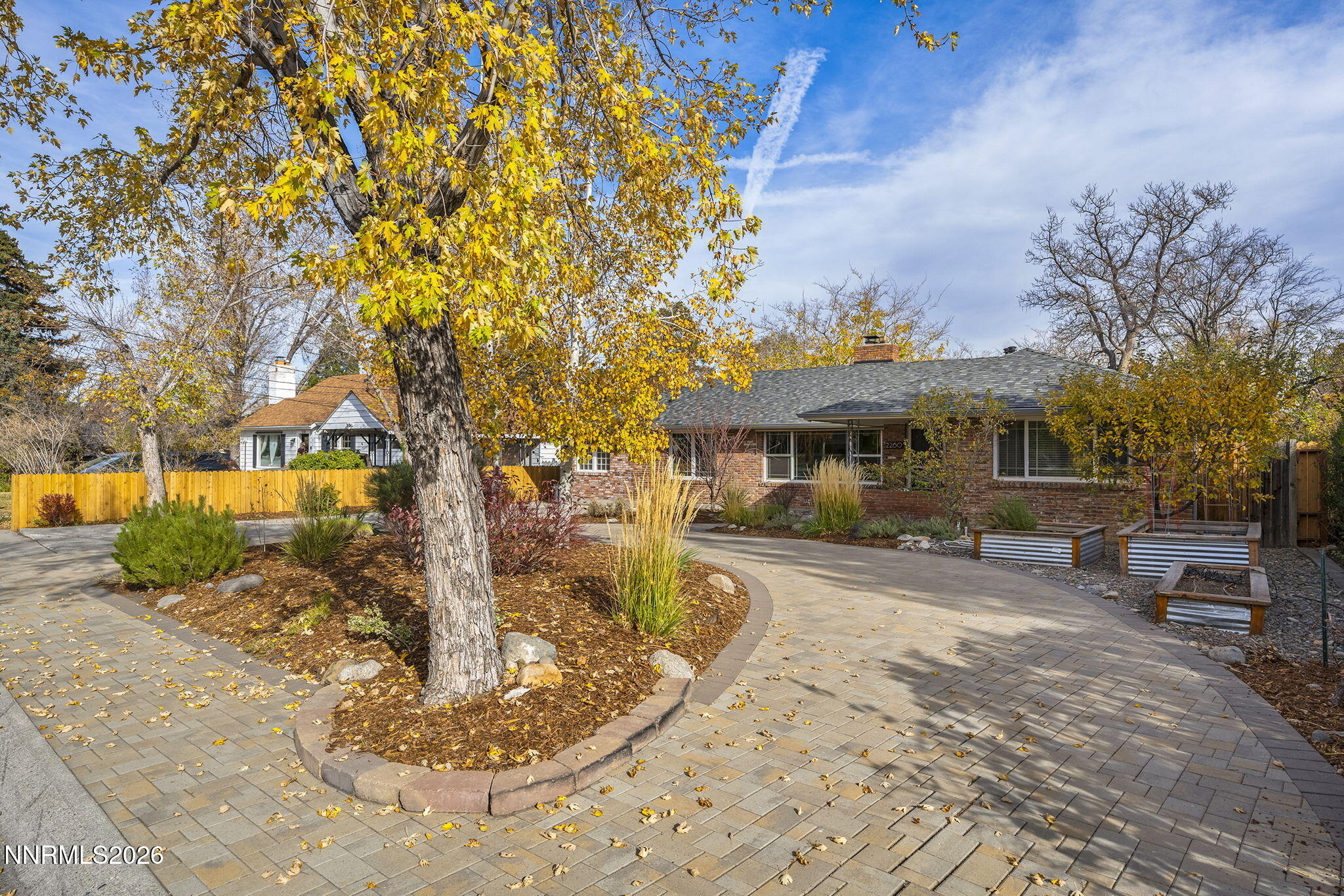 a view of a house with backyard porch and sitting area