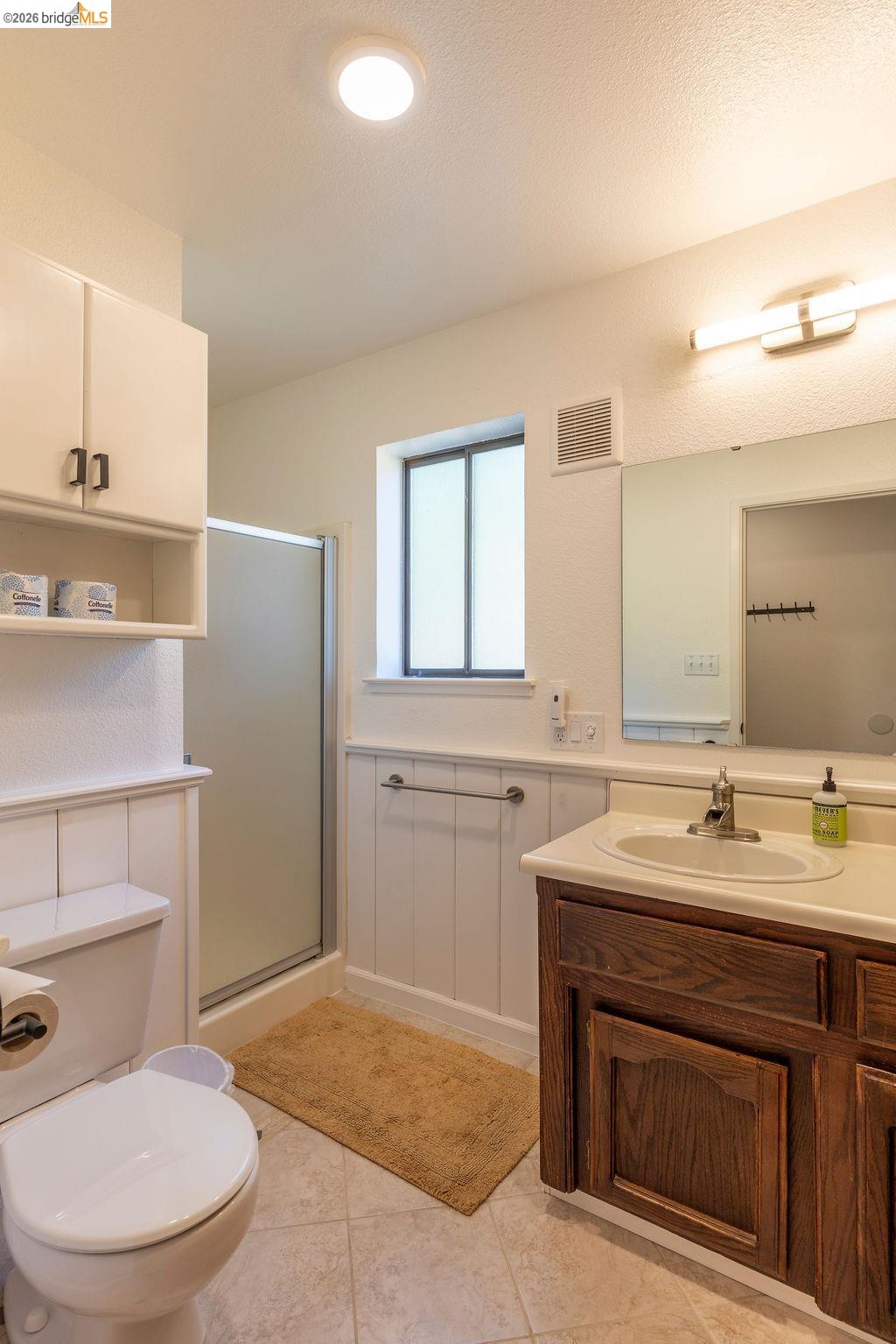19266 Ferretti Road Groveland, CA 95321 - Photo 12 of 50 Bathroom featuring vanity, a stall shower, and light tile patterned flooring
