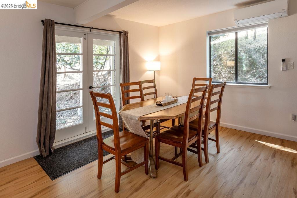 19266 Ferretti Road Groveland, CA 95321 - Photo 17 of 50 Dining room with light wood finished floors, beam ceiling, and french doors