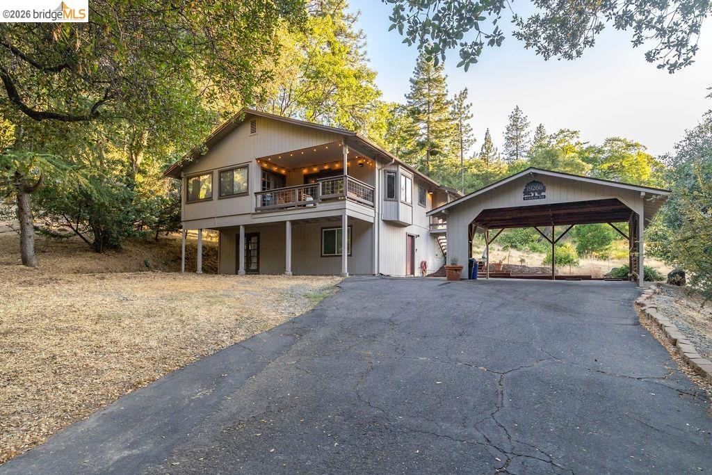 19266 Ferretti Road Groveland, CA 95321 - Photo 23 of 50 View of front of house featuring driveway and a deck