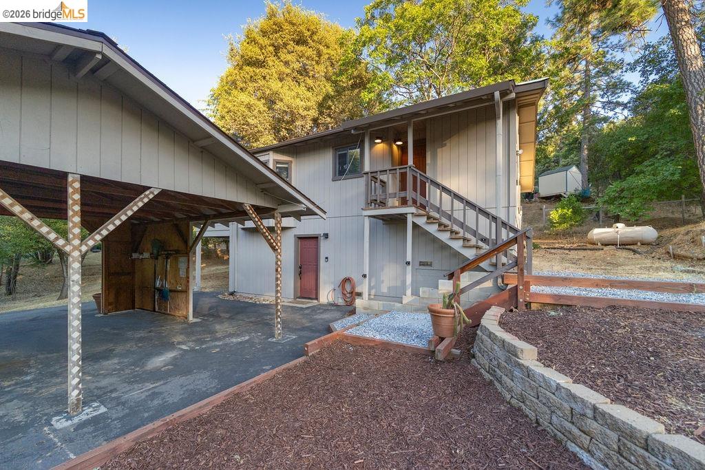 19266 Ferretti Road Groveland, CA 95321 - Photo 24 of 50 Rear view of property featuring stairs and a patio area