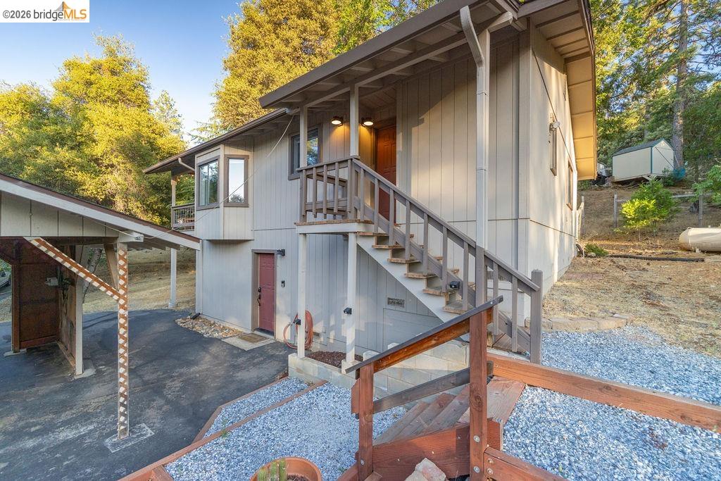 19266 Ferretti Road Groveland, CA 95321 - Photo 25 of 50 View of side of home with stairs and a patio area