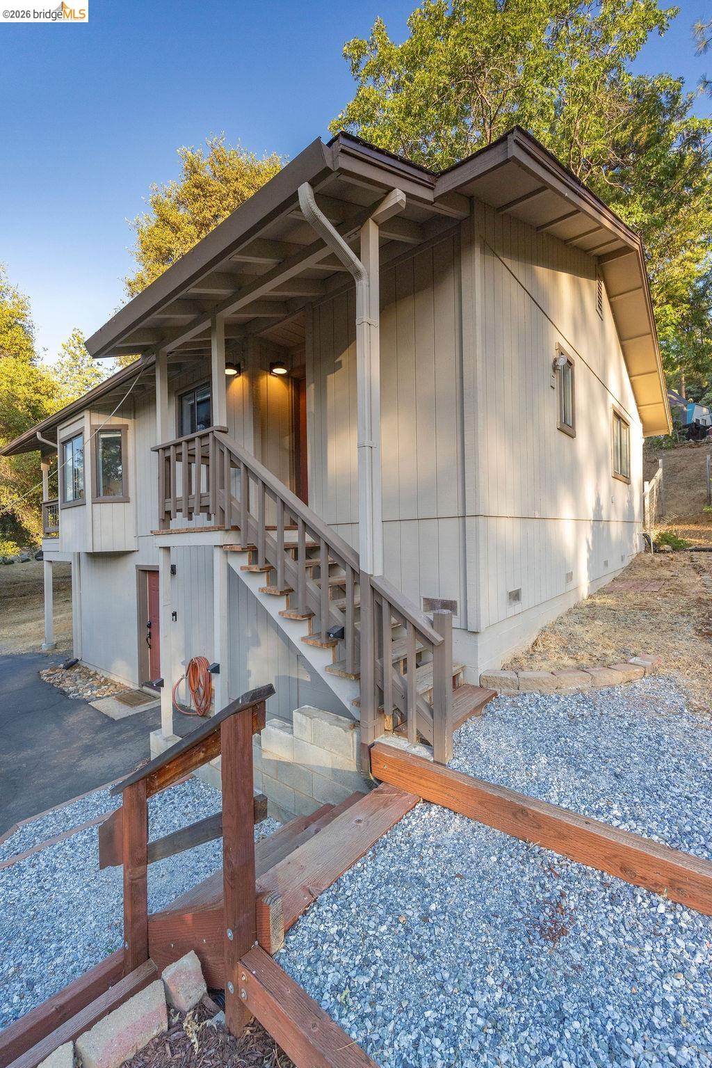19266 Ferretti Road Groveland, CA 95321 - Photo 26 of 50 View of side of property with crawl space and stairs