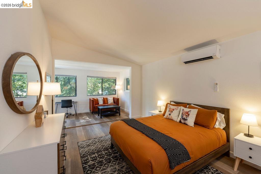 19266 Ferretti Road Groveland, CA 95321 - Photo 7 of 50 wood-style floors, vaulted ceiling, and a wall mounted mini split