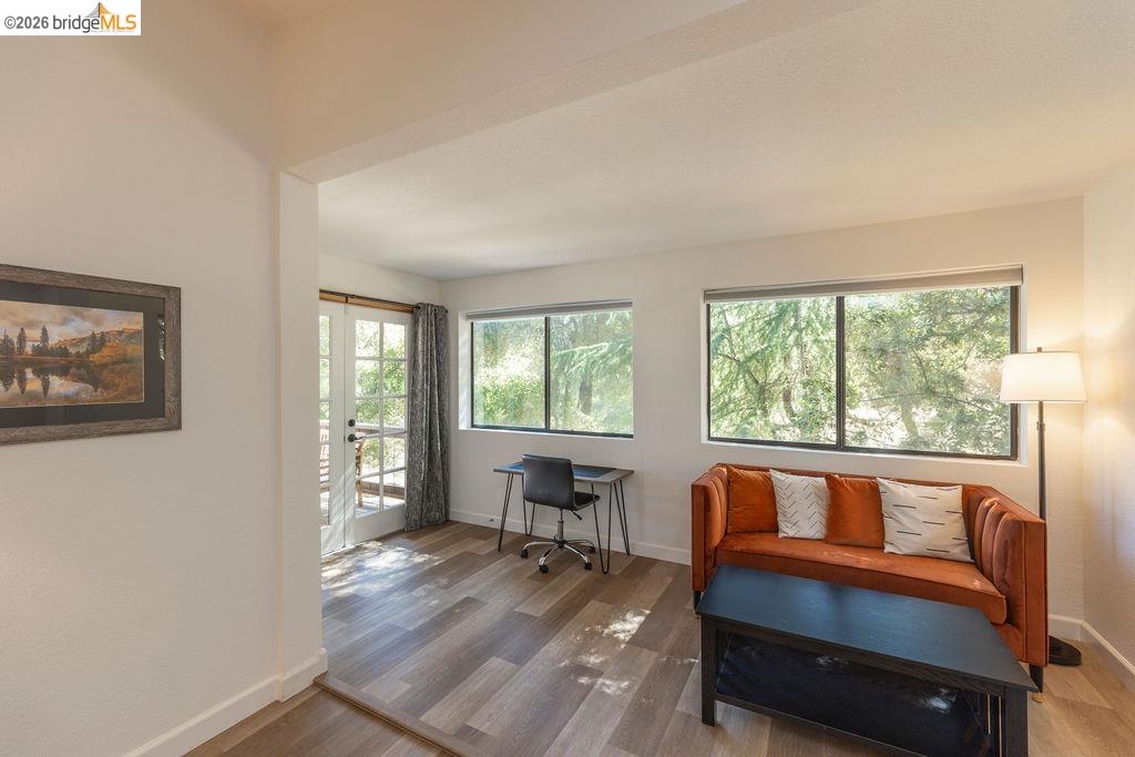 19266 Ferretti Road Groveland, CA 95321 - Photo 8 of 50 Living area featuring wood finished floors and a desk