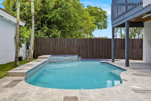 a view of a living room and bathroom