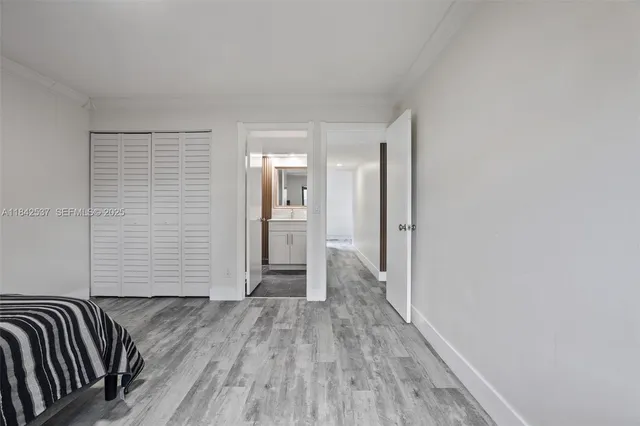 a view of an empty room and wooden floor