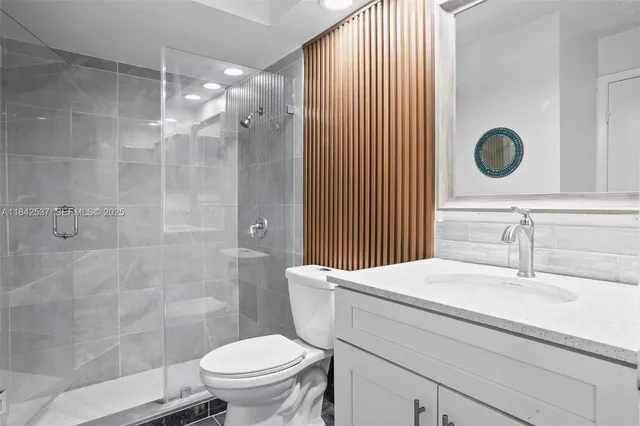 an empty room with wooden floor and window