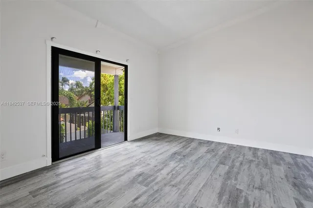 an aerial view of residential building with parking