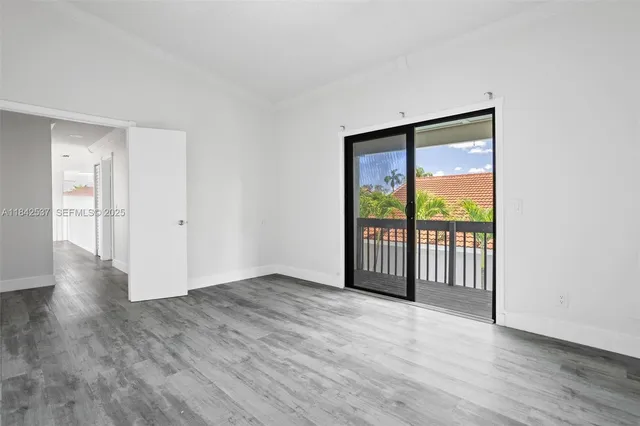 an aerial view of residential houses with city view