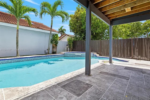 a view of a back yard of the house