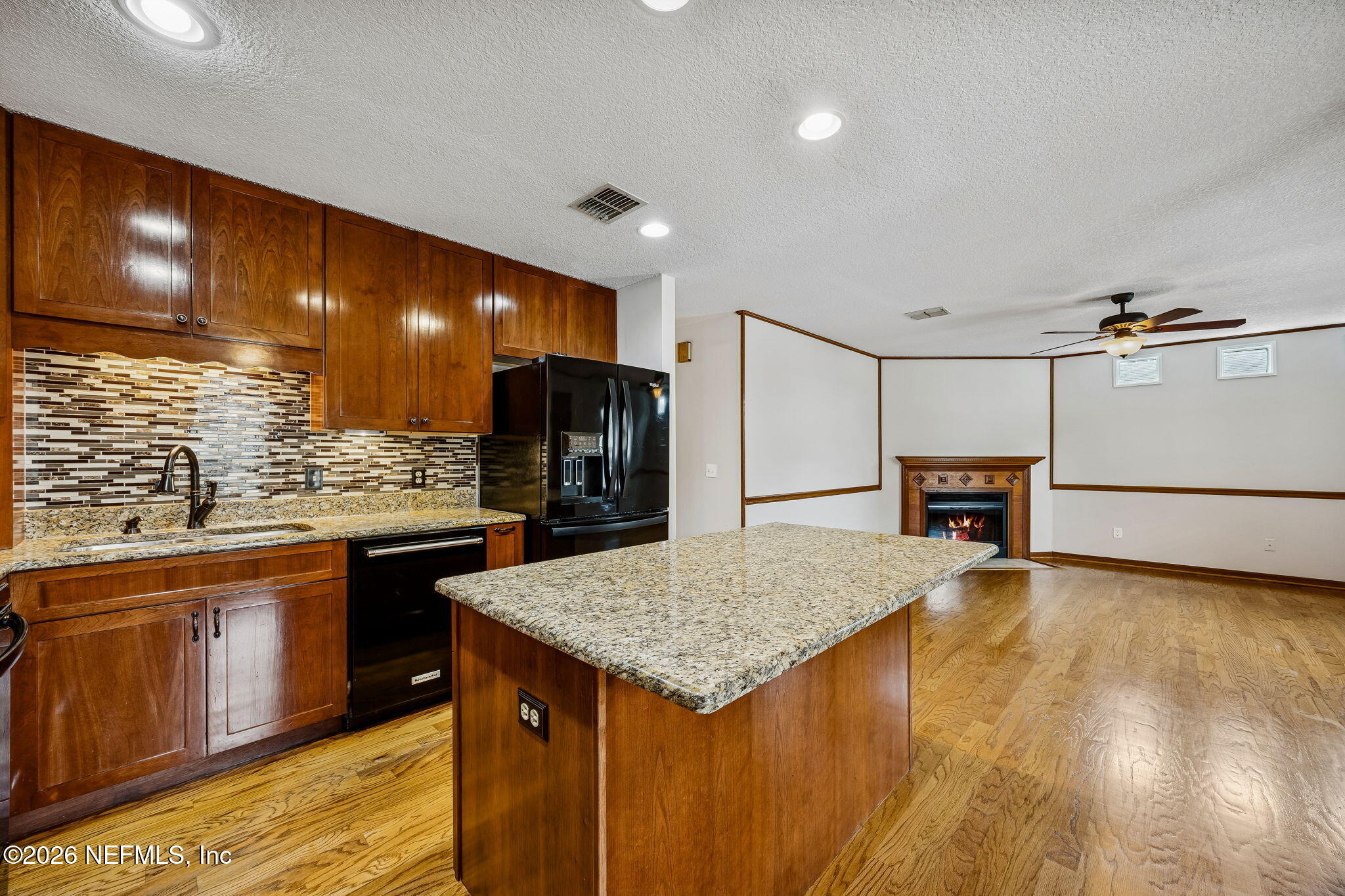 1888 Clemson Road Jacksonville, FL 32217 - Photo 5 of 41 a kitchen with stainless steel appliances granite countertop a sink and a refrigerator