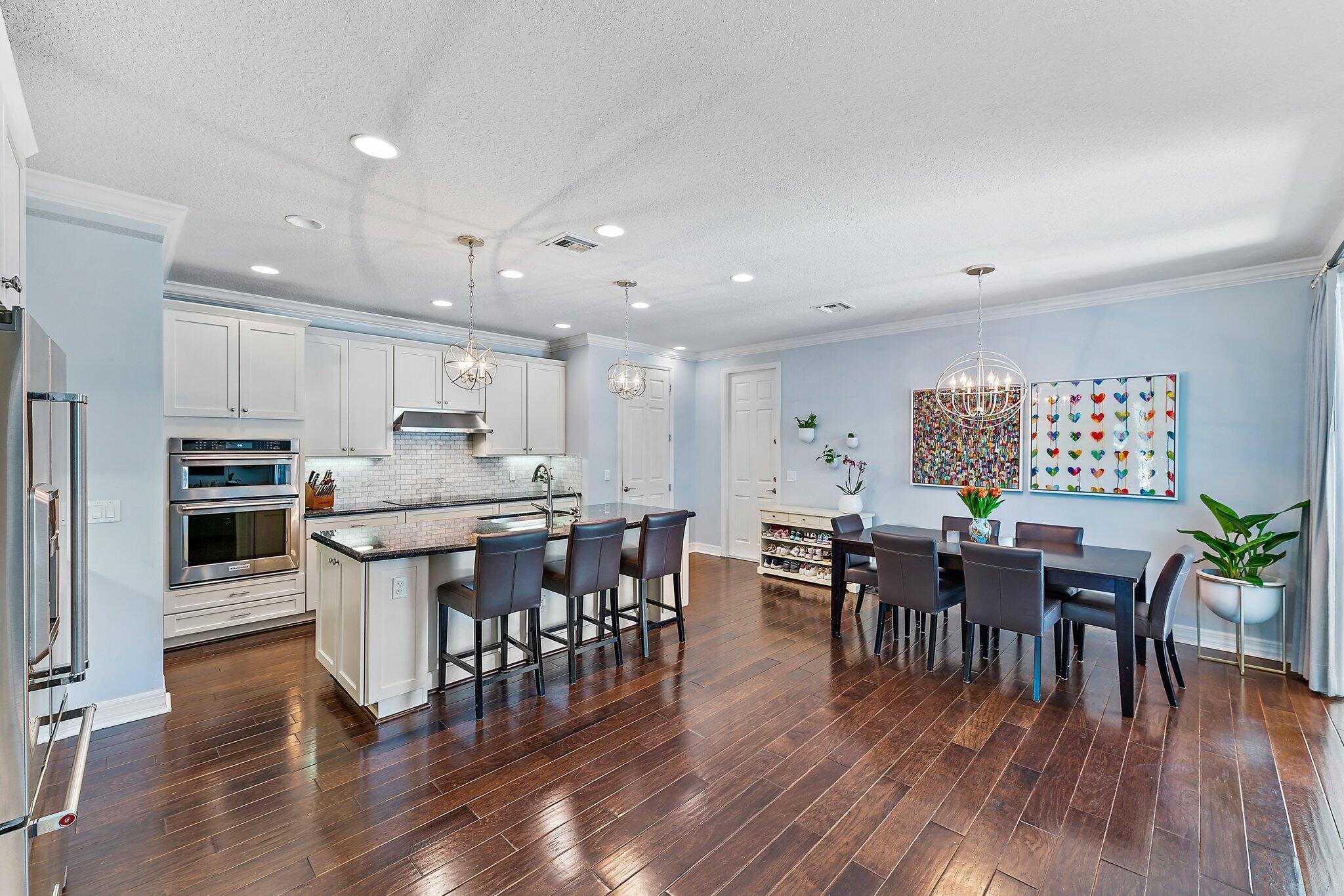 2835 East Mallory Boulevard Jupiter, FL 33458 - Photo 11 of 51 a view of kitchen with cabinets table and chairs
