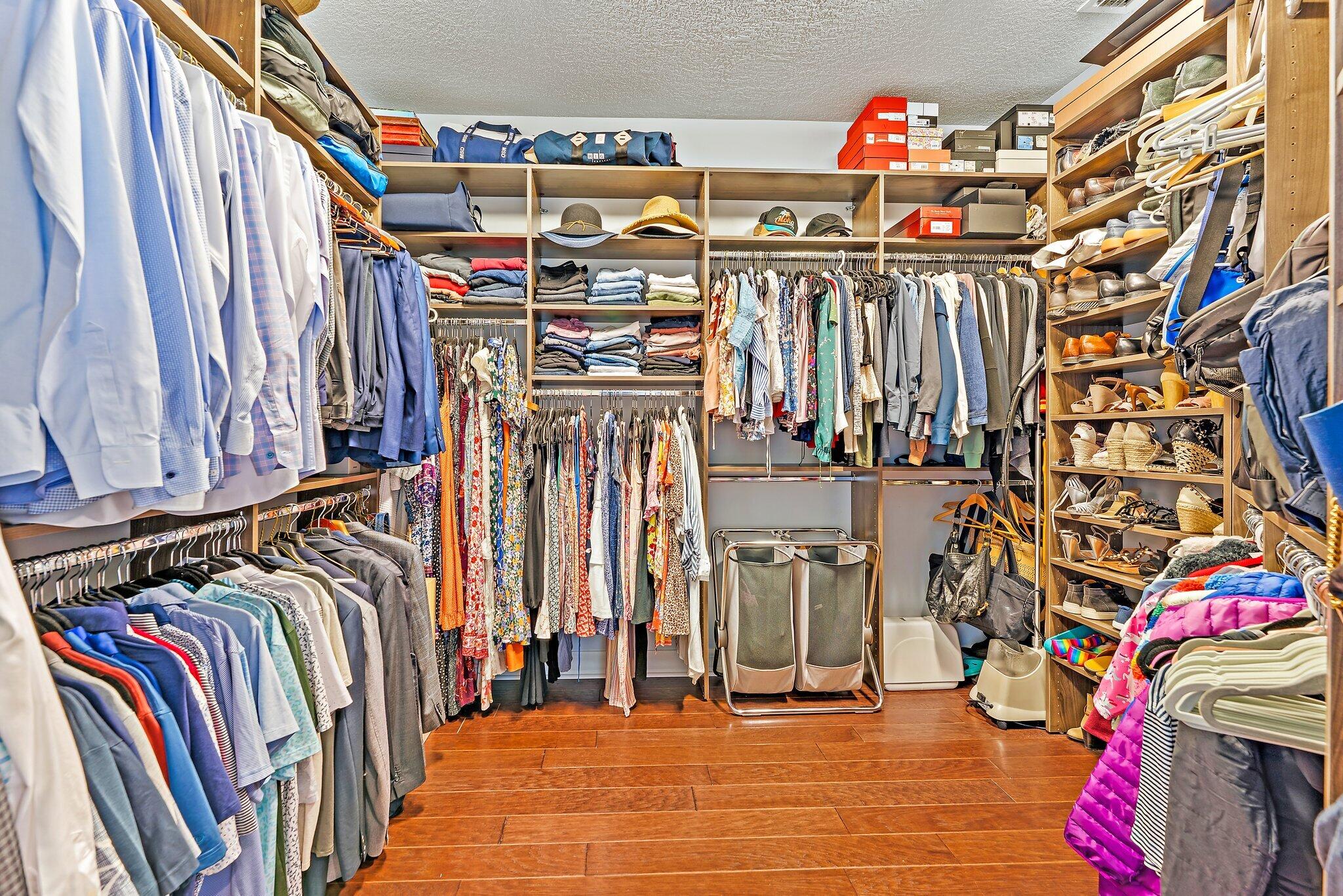 2835 East Mallory Boulevard Jupiter, FL 33458 - Photo 18 of 51 a view of walk in closet with clothes and shoes