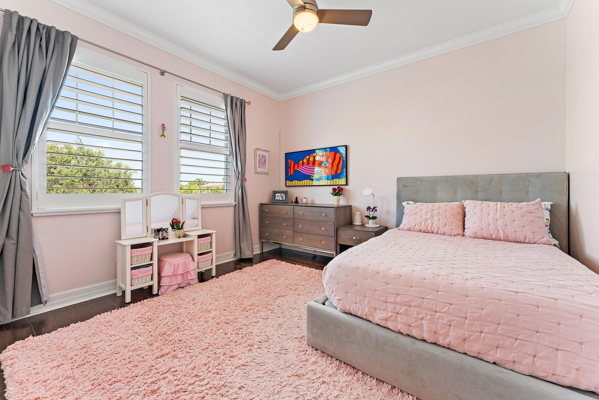 2835 East Mallory Boulevard Jupiter, FL 33458 - Photo 24 of 51 a bedroom with a bed and a window