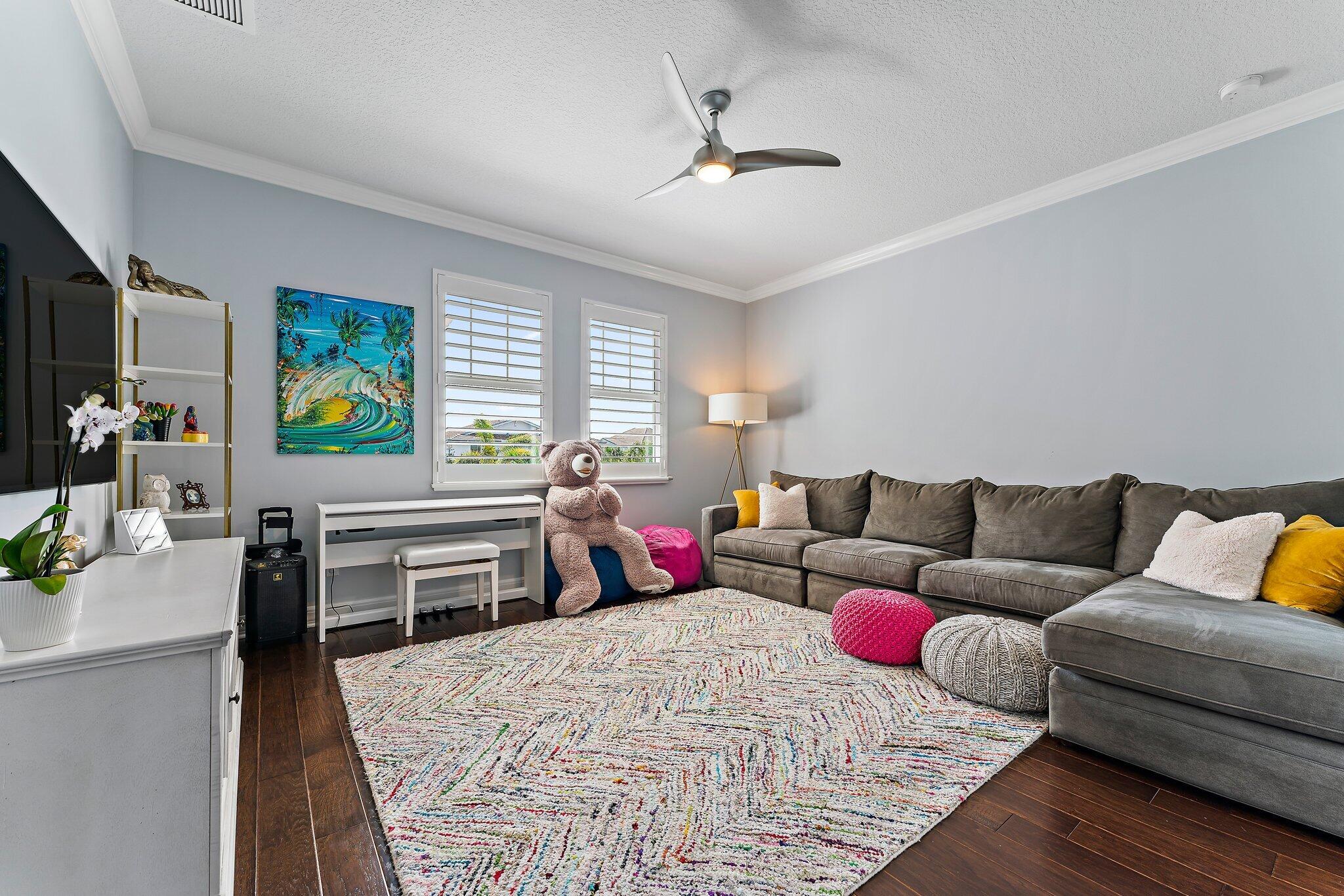 2835 East Mallory Boulevard Jupiter, FL 33458 - Photo 26 of 51 a living room with furniture and wooden floor