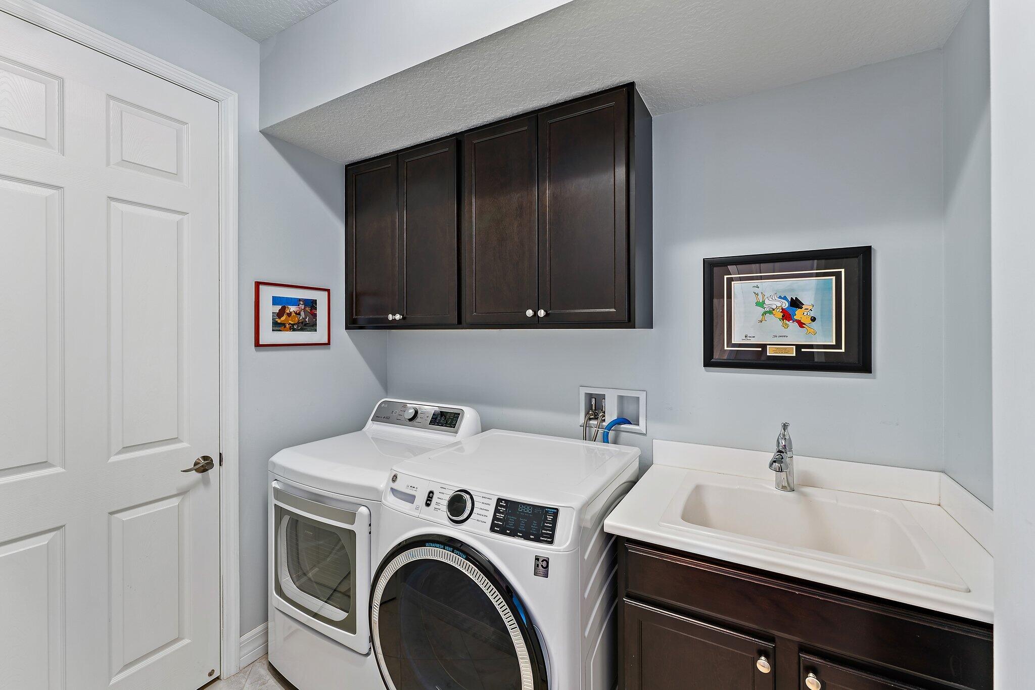 2835 East Mallory Boulevard Jupiter, FL 33458 - Photo 30 of 51 a utility room with dryer and washer