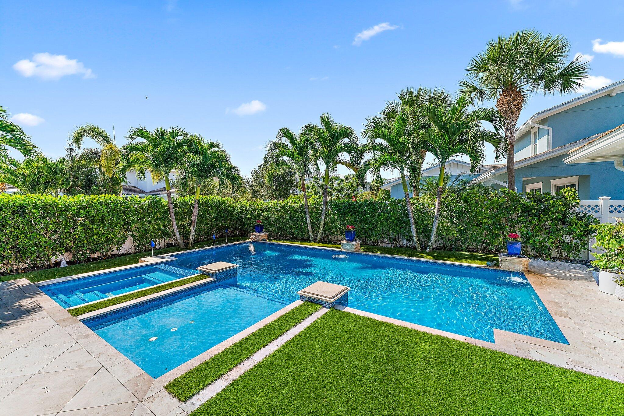 2835 East Mallory Boulevard Jupiter, FL 33458 - Photo 34 of 51 a view of swimming pool with seating area and garden