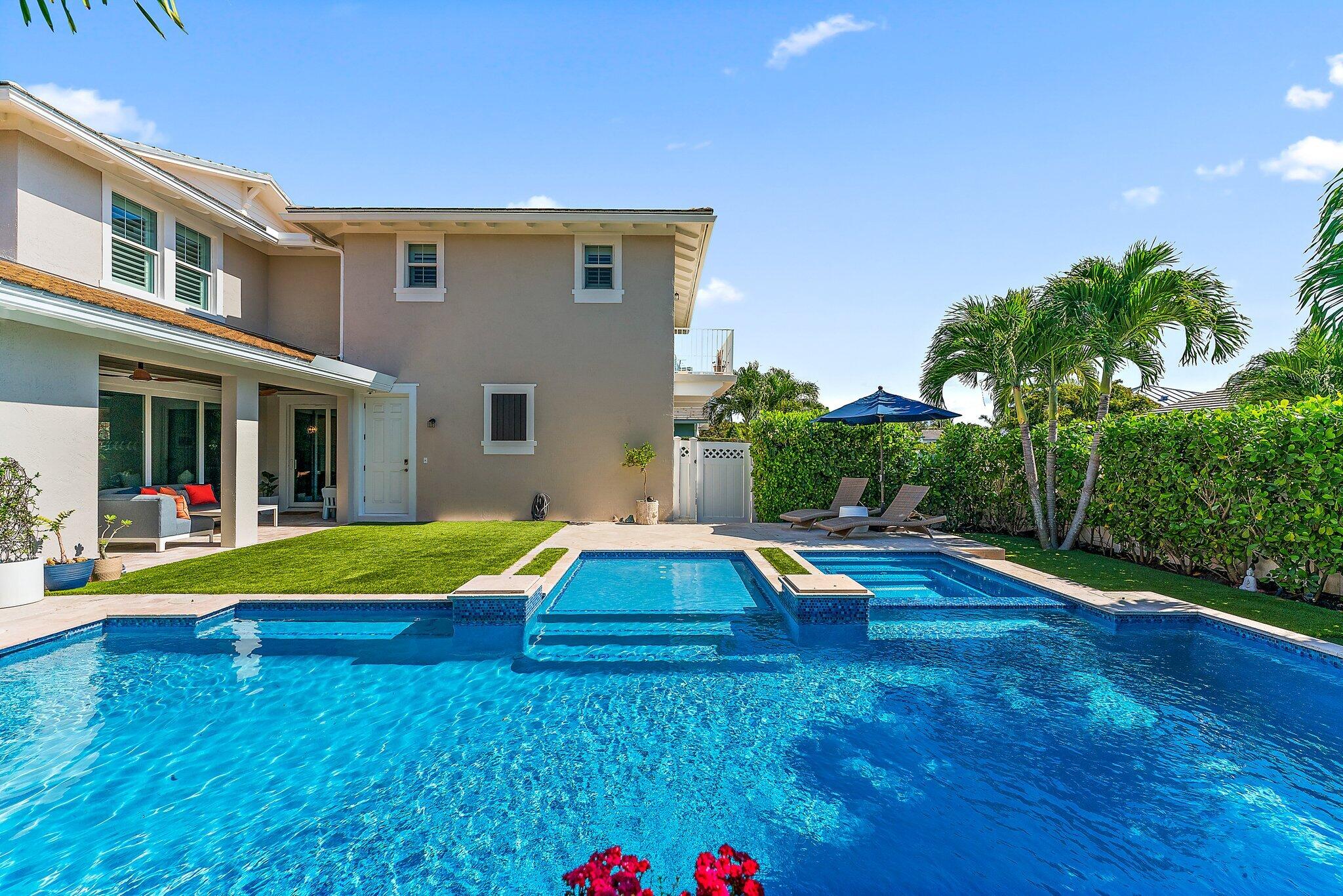 2835 East Mallory Boulevard Jupiter, FL 33458 - Photo 35 of 51 a view of pool with lawn chairs and large trees
