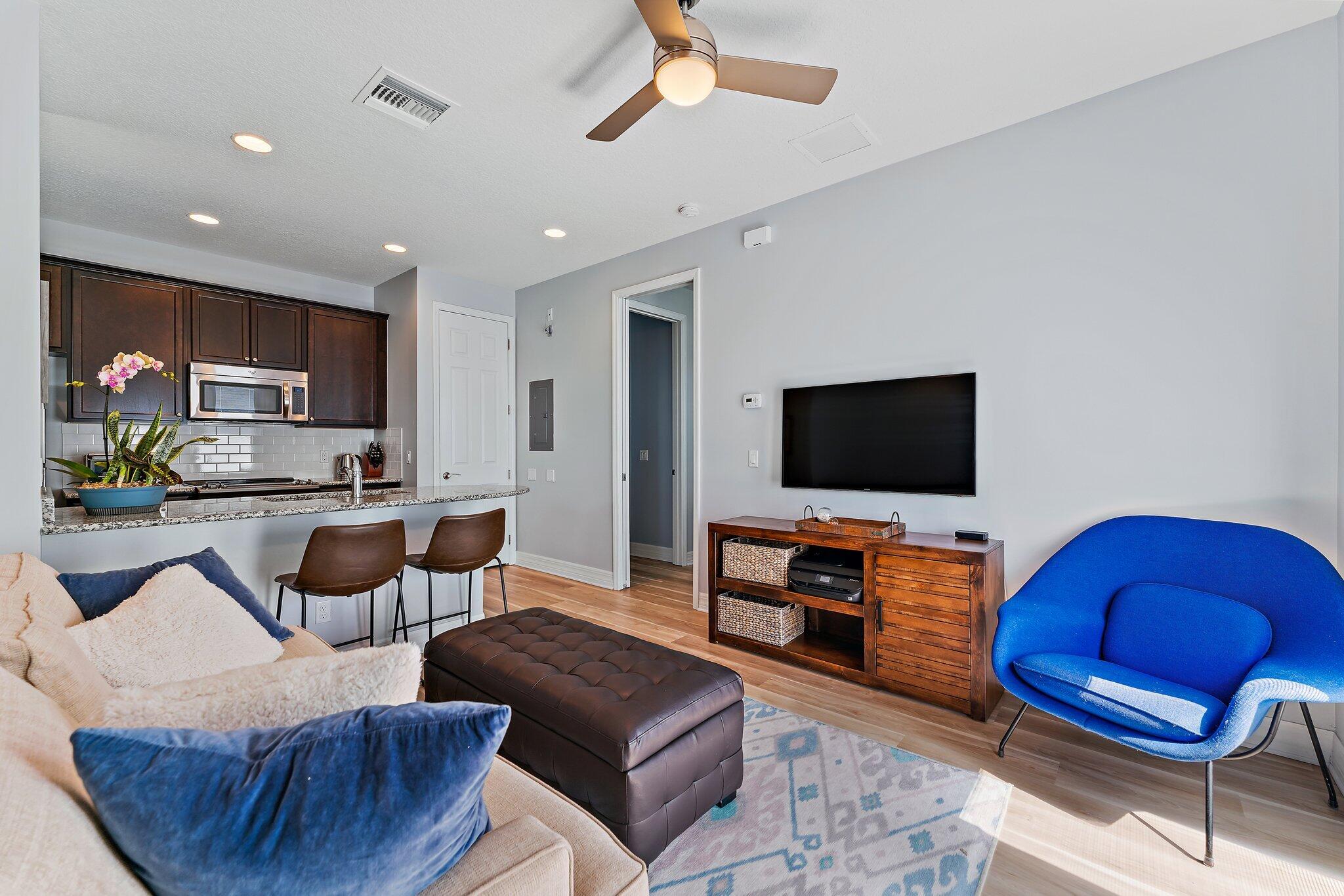 2835 East Mallory Boulevard Jupiter, FL 33458 - Photo 40 of 51 a living room with furniture and a flat screen tv