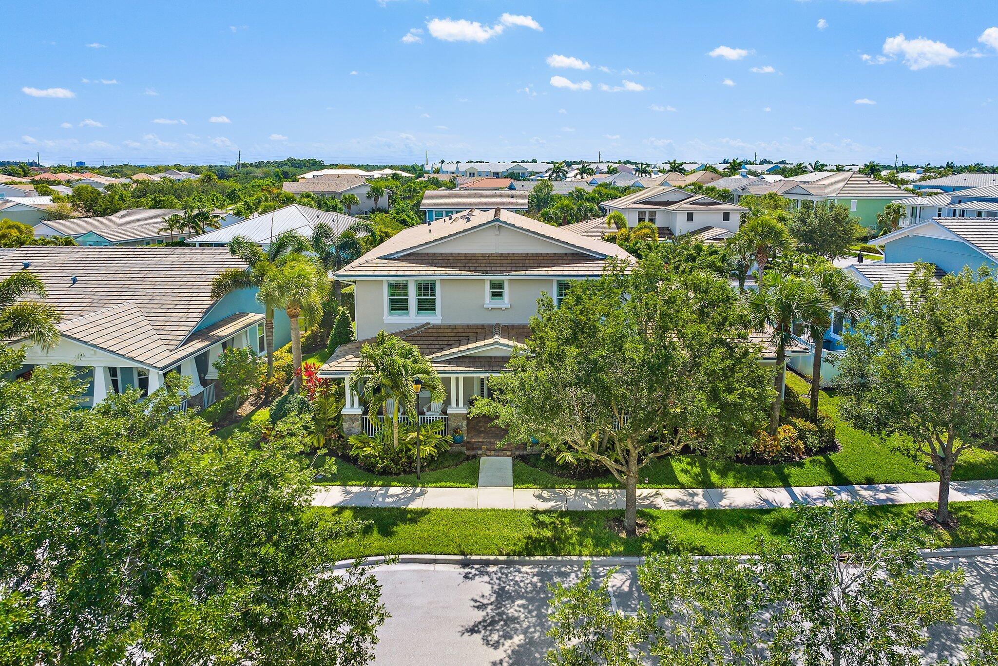 2835 East Mallory Boulevard Jupiter, FL 33458 - Photo 45 of 51 a aerial view of a house with a yard and lake view