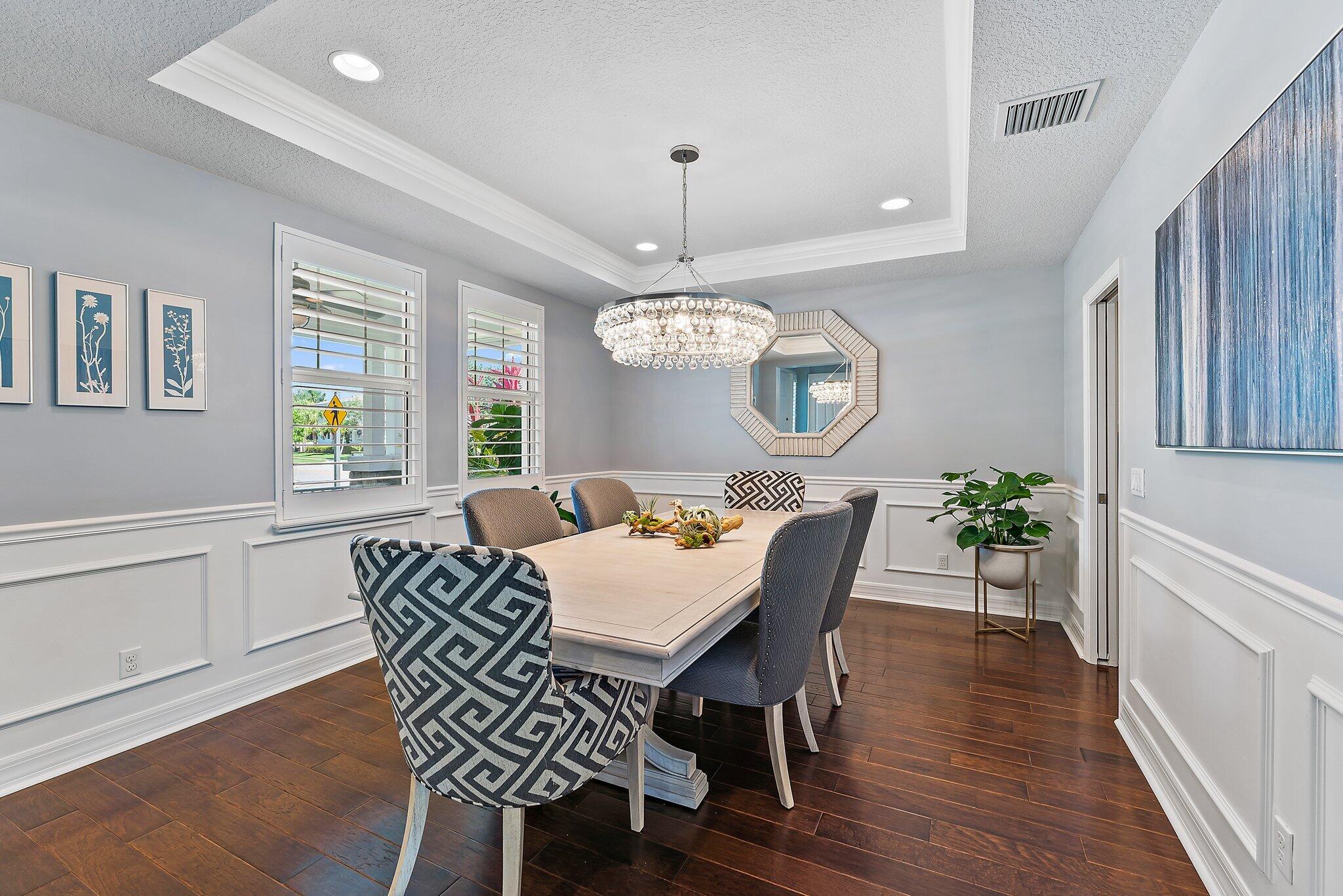 2835 East Mallory Boulevard Jupiter, FL 33458 - Photo 7 of 51 a view of a dining room with furniture window and wooden floor