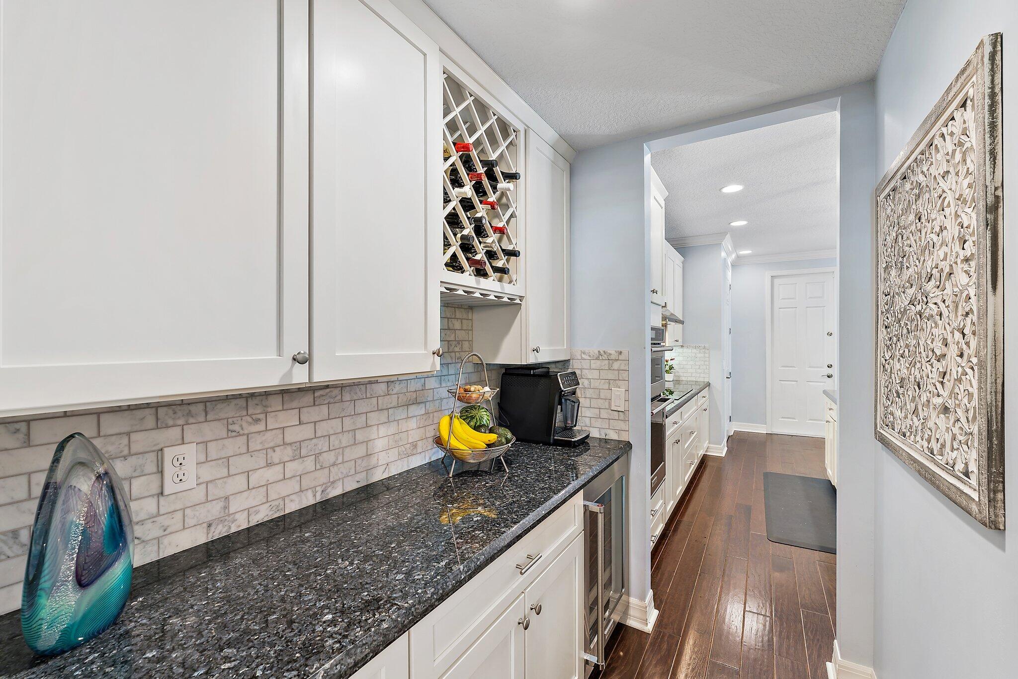 2835 East Mallory Boulevard Jupiter, FL 33458 - Photo 8 of 51 a kitchen with sink and window