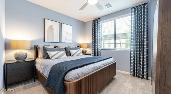 a bedroom with bed and window