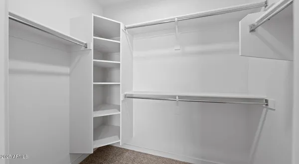 a view of an empty walk in closet