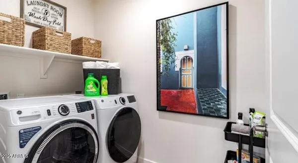 a utility room with dryer and washer