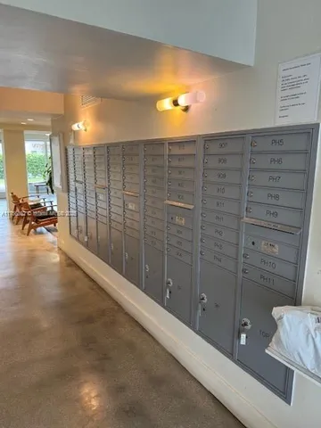 a kitchen with stainless steel appliances granite countertop wooden cabinets and granite counter tops