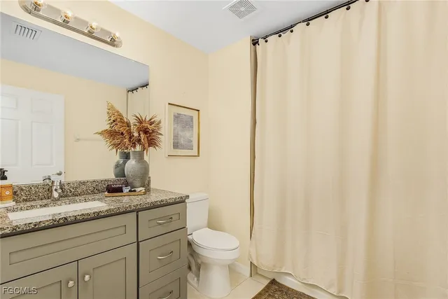 a stove top oven sitting inside of a kitchen