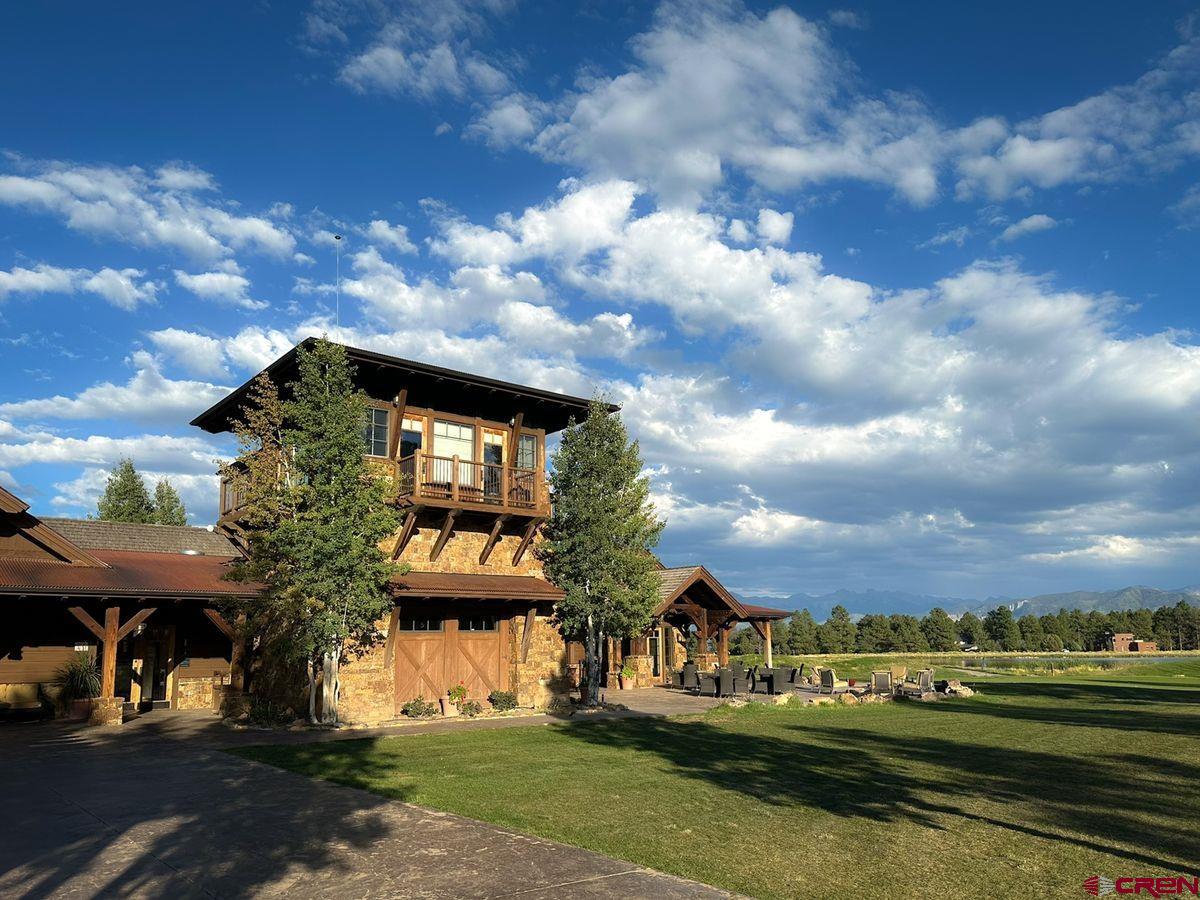 Tbd Pronghorn Lane Ridgway, CO 81432 - Photo 21 of 21 a view of a white house with a big yard and potted plants