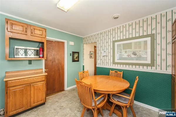 a dining room with furniture and window