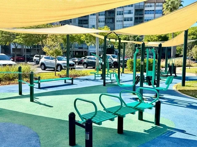 a utility room with cabinets washer and dryer